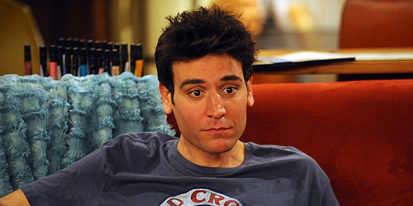 Ted Mosby sits on his couch in How I Met Your Mother.