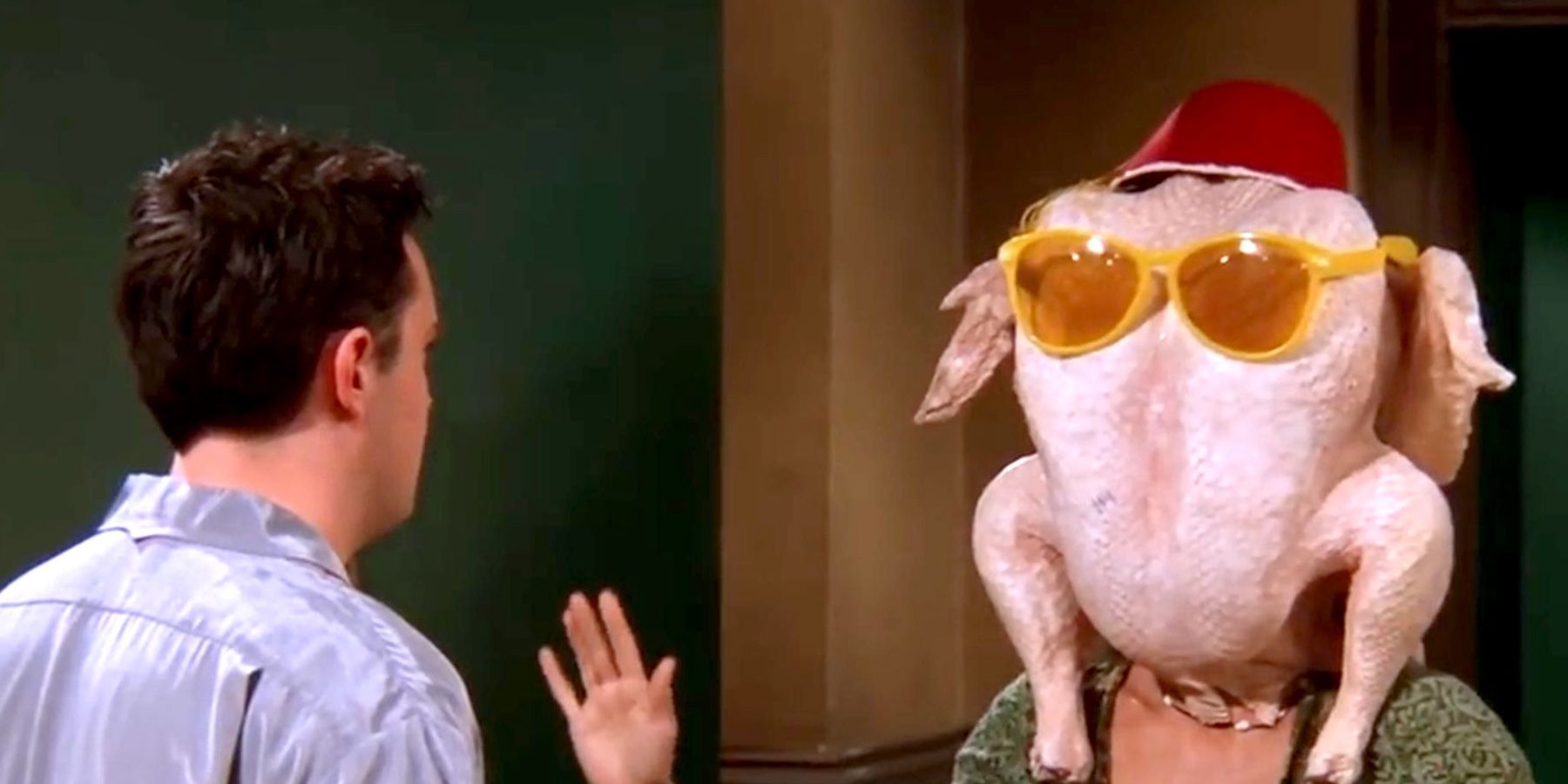 Monica Geller wearing a turkey on her head on Thanksgiving