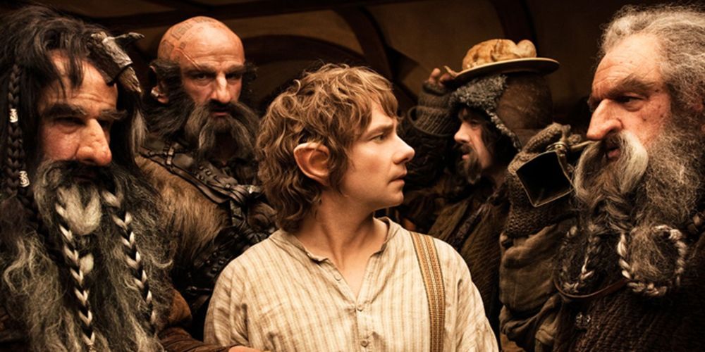 Bilbo Baggins surrounded by Dwarves in The Hobbit: An Unexpected Journey