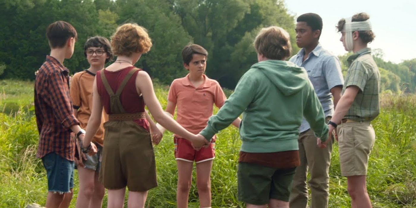The Losers Club holding hands in IT (2017)