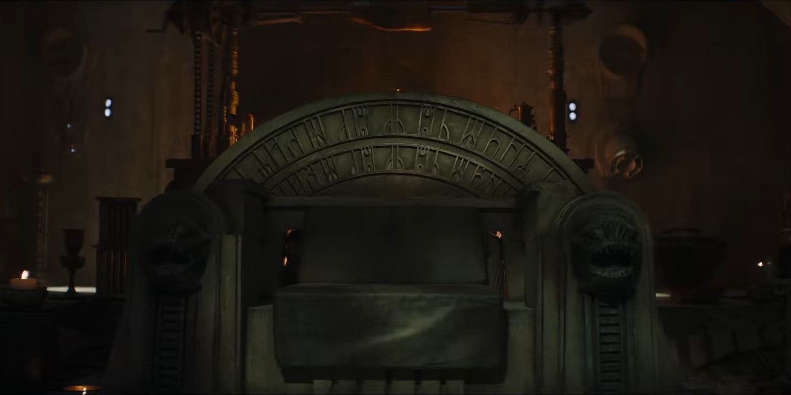 The Throne in Jabba's Palace in Star Wars The Book of Boba Fett. Notably, rancor heads are carved into the armrests.