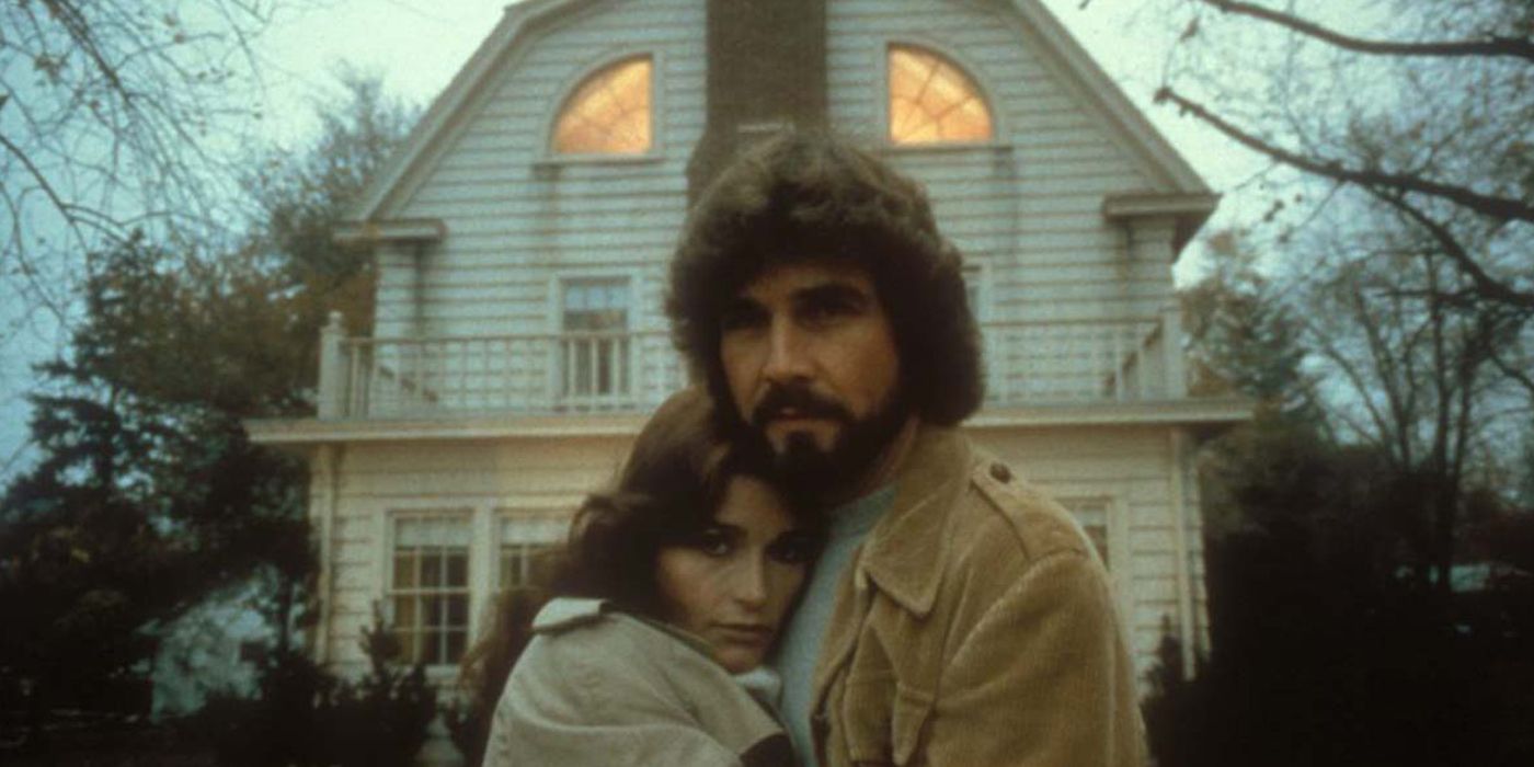 The cast of The Amityville Horror with a house in the background
