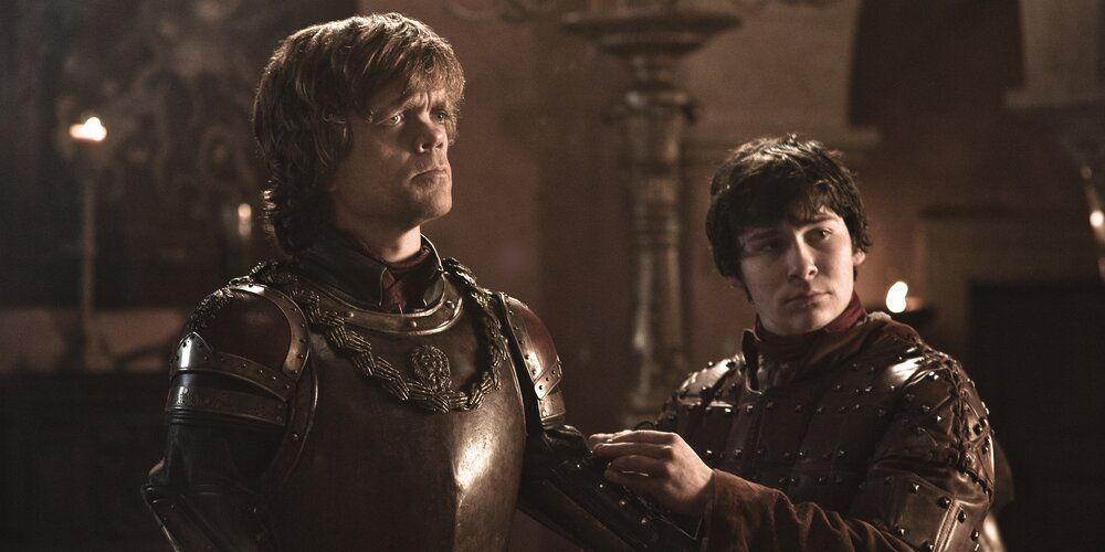 Podrick Payne helps Tyrion with his armor in Game of Thrones