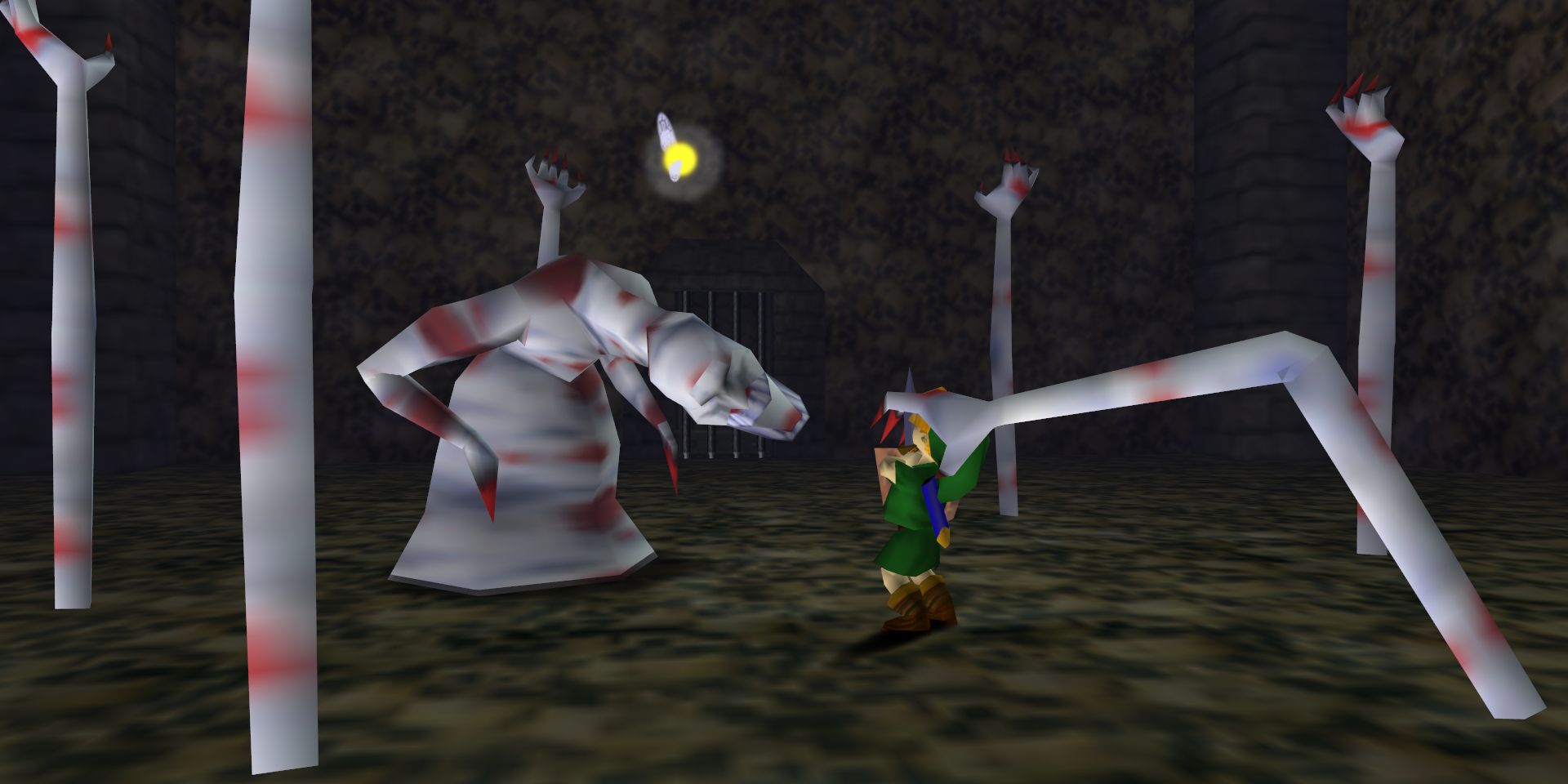 Dead Hand attacks Link at the bottom of the well in The Legend of Zelda: Ocarina Of Time.