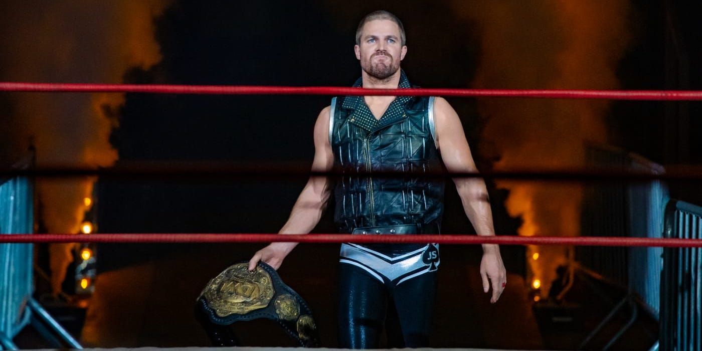 Stephen Amell holds his title belt in Starz's Heels.