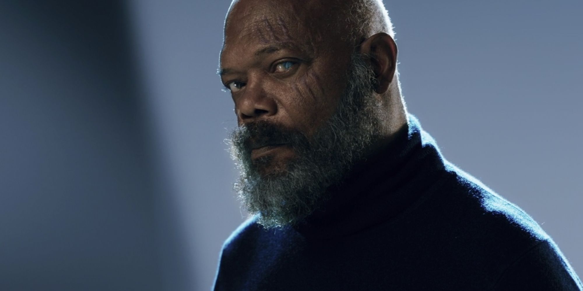 Nick Fury without his eye patch looking at the camera