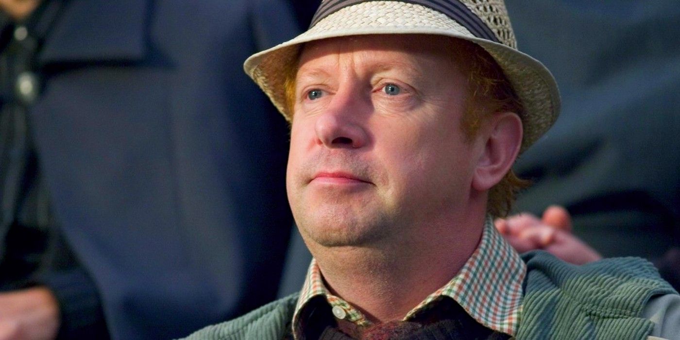 Arthur Weasley looking at something in Harry Potter.