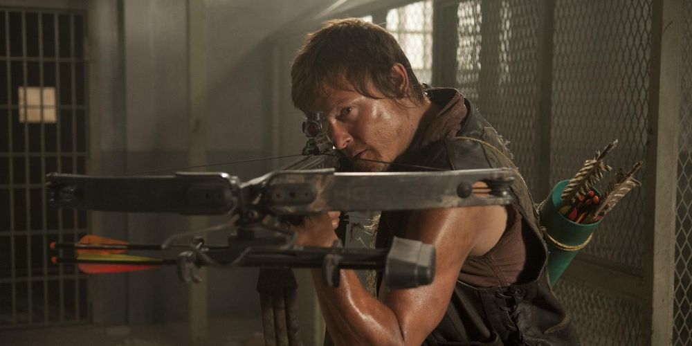 Daryl Dixon aiming his crossbow in The Walking Dead