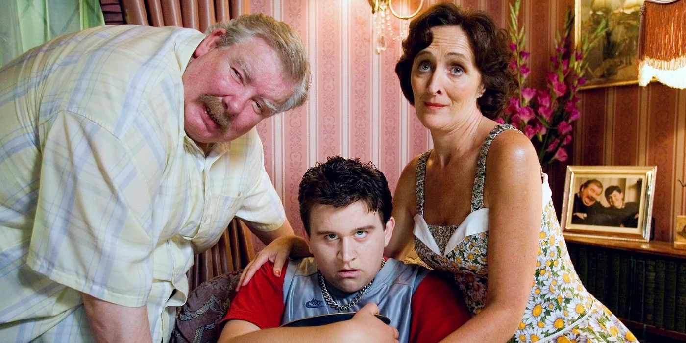 Vernon and Petunia Dursley stand by their son, Dudley, in their living room in Harry Potter