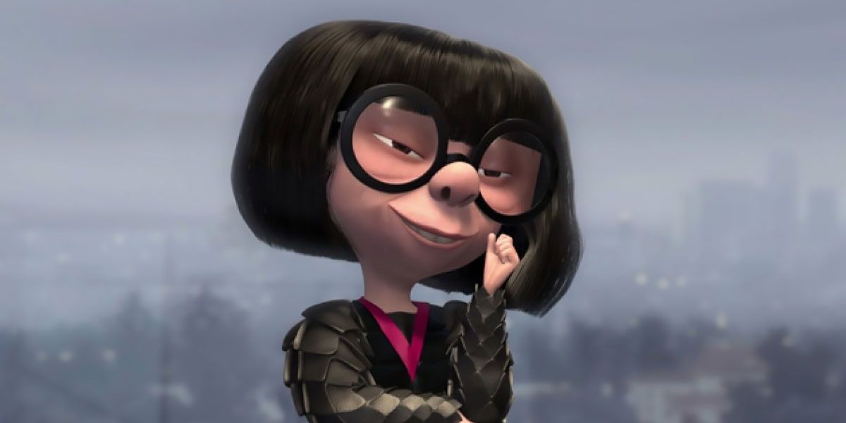 Edna smiles with a hand by her mouth