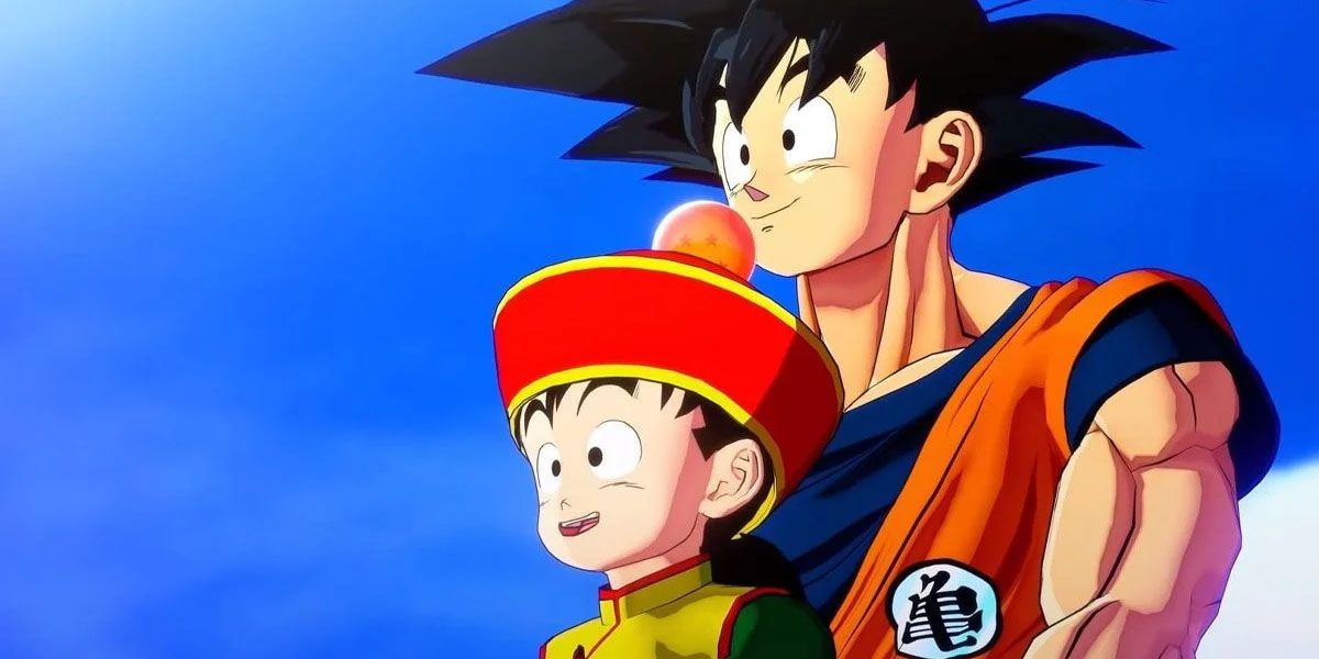 Goku holds a young Gohan in front of a partly cloudy blue sky.