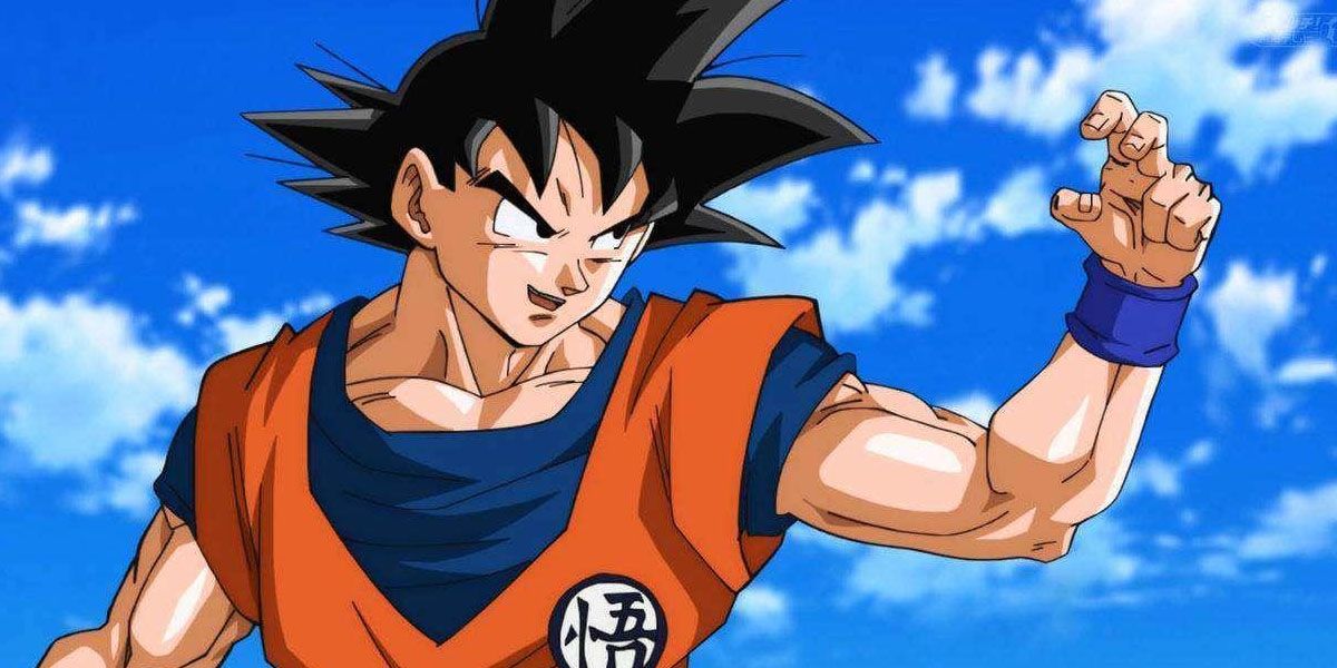 Goku gets into a fighting stance, narrowing his eyes and holding out a half-closed fist.