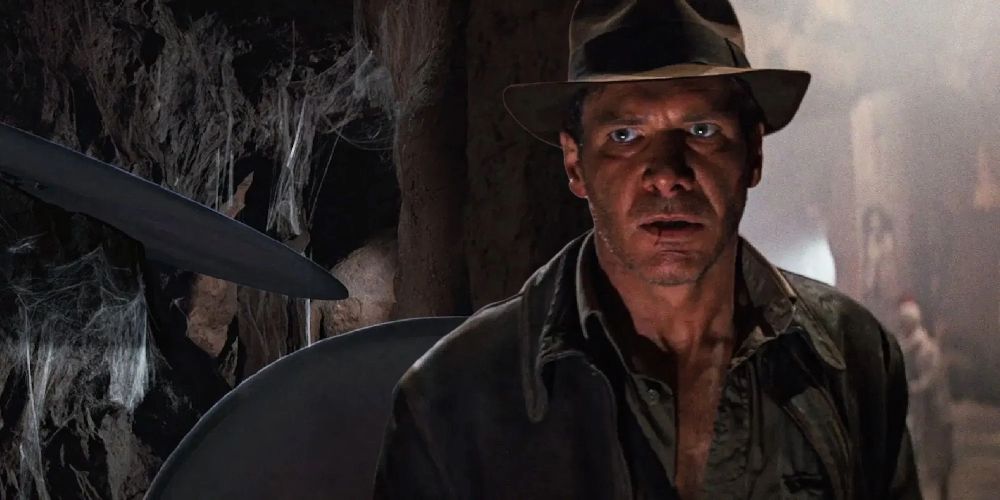 Indiana Jones avoids a blade trap in The Last Crusade