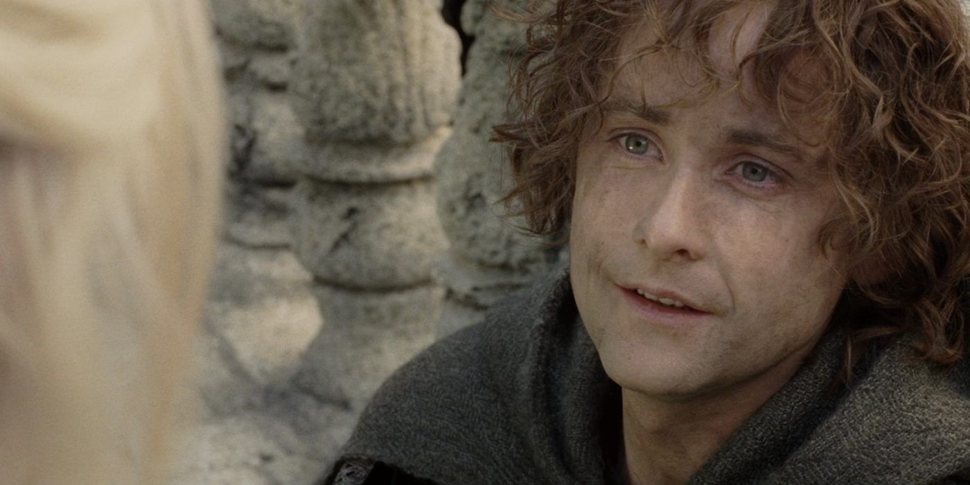 Pippin (Billy Boyd) looks up at Gandalf in The Return of the King
