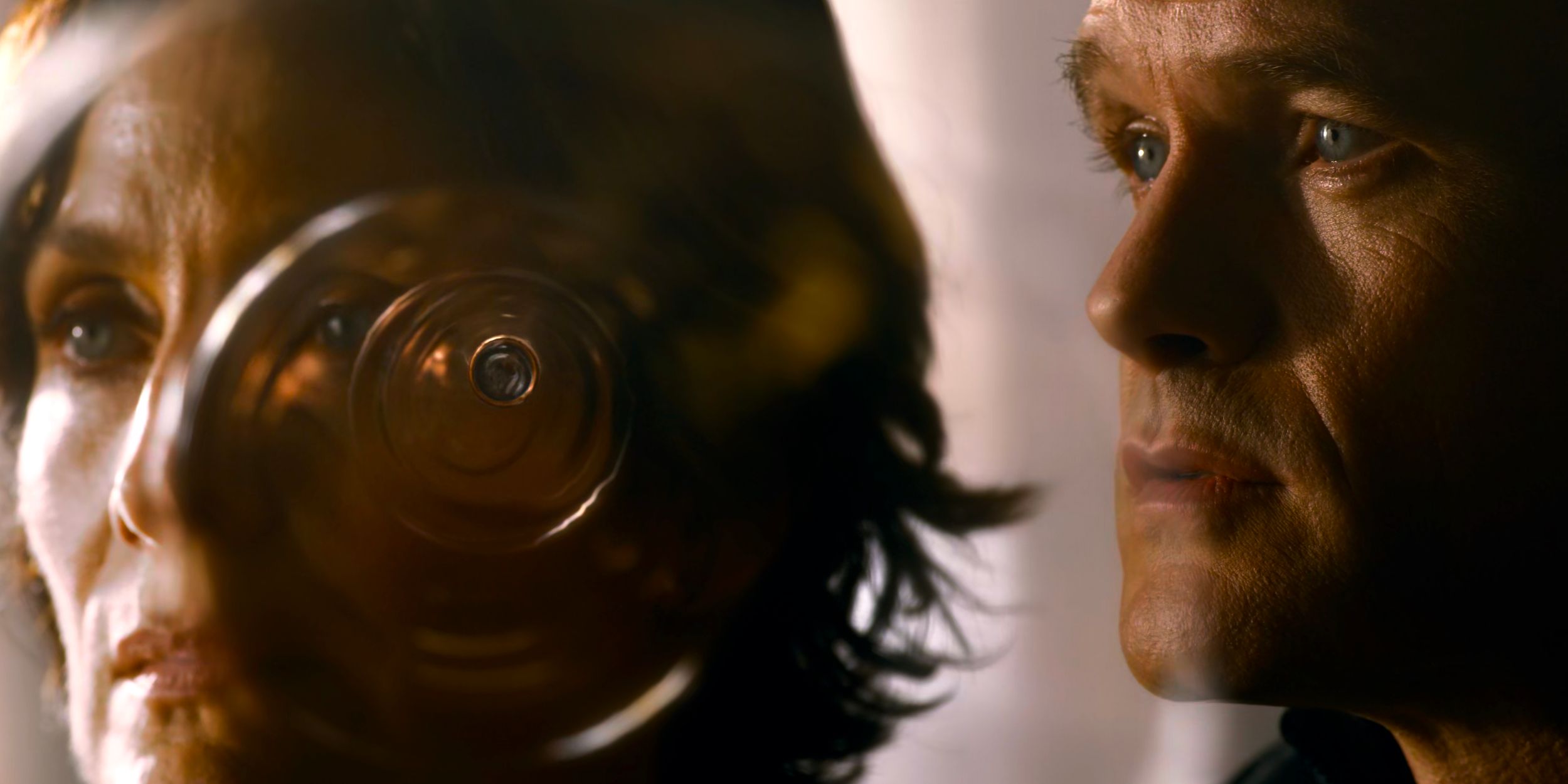 The Analyst (Neil Patrick Harris) watching a bullet in slow motion as it speeds towards Trinity (Carrie Anne-Moss)