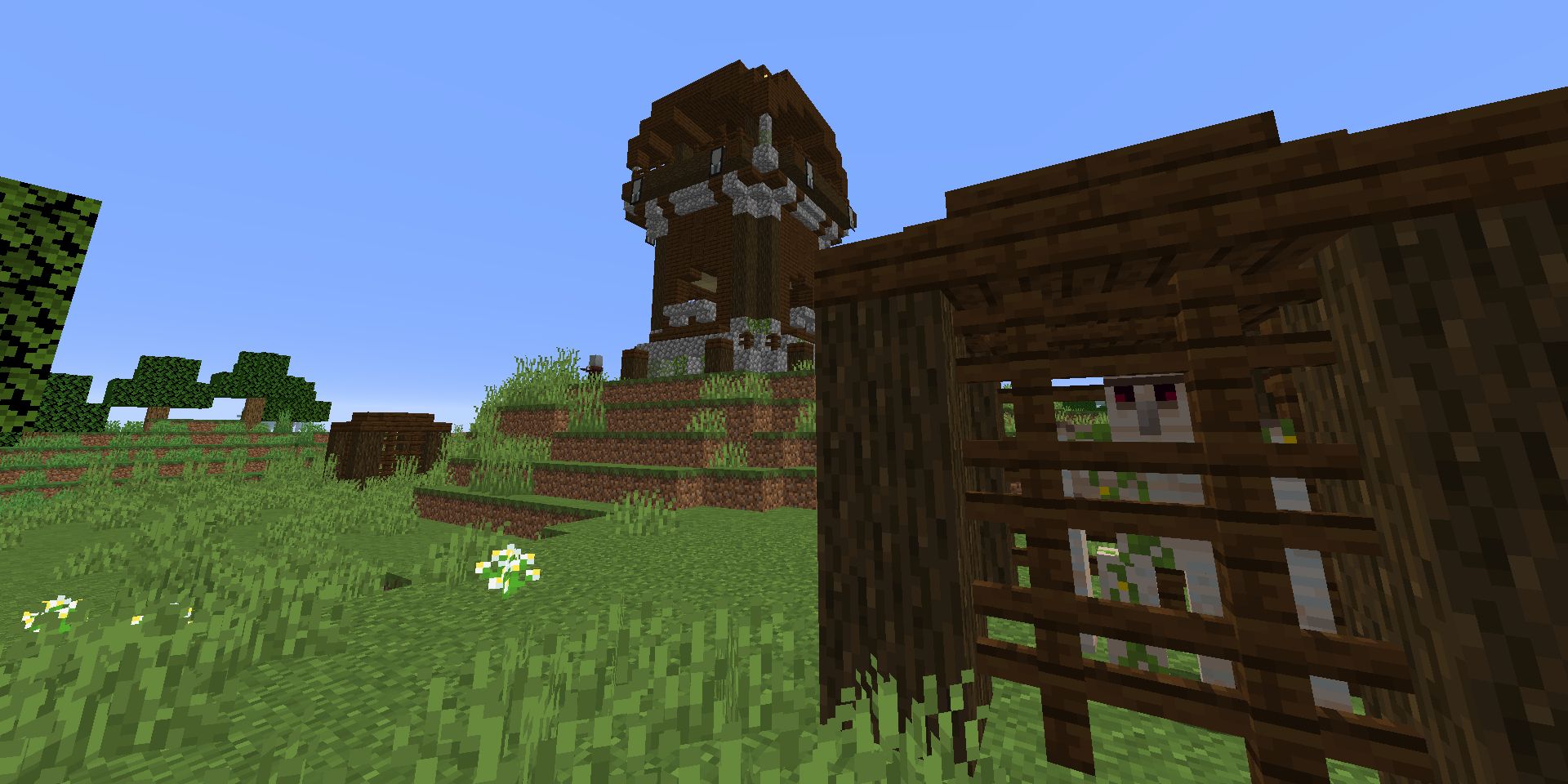 Screenshot of a trapped Iron Golem in a pillager outpost in Minecraft.