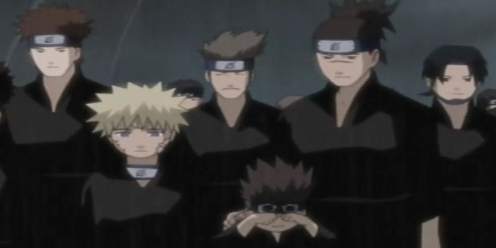 Iruka and Naruto at the third hokage's funeral
