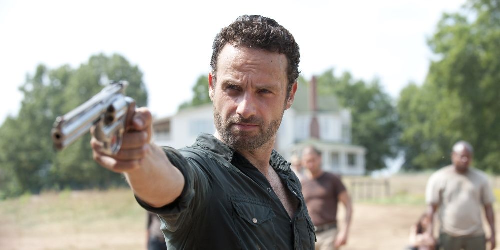 Rick Grimes firing his gun in his own distinctive way The Walking Dead