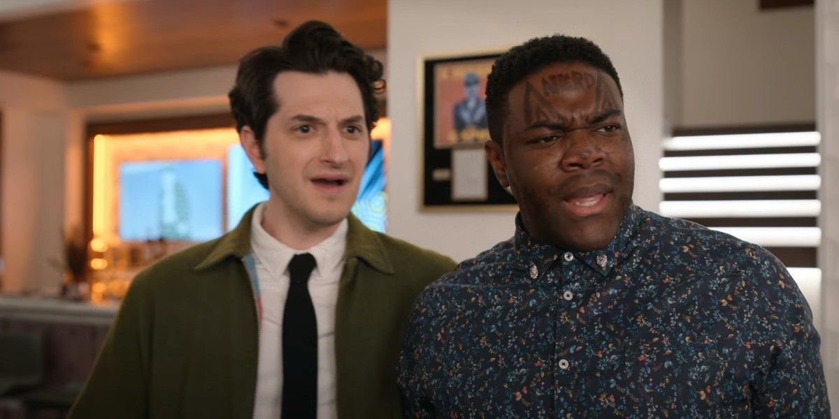 Ben Schwartz and Sam Richardson look surprised in a scene from The Afterparty.
