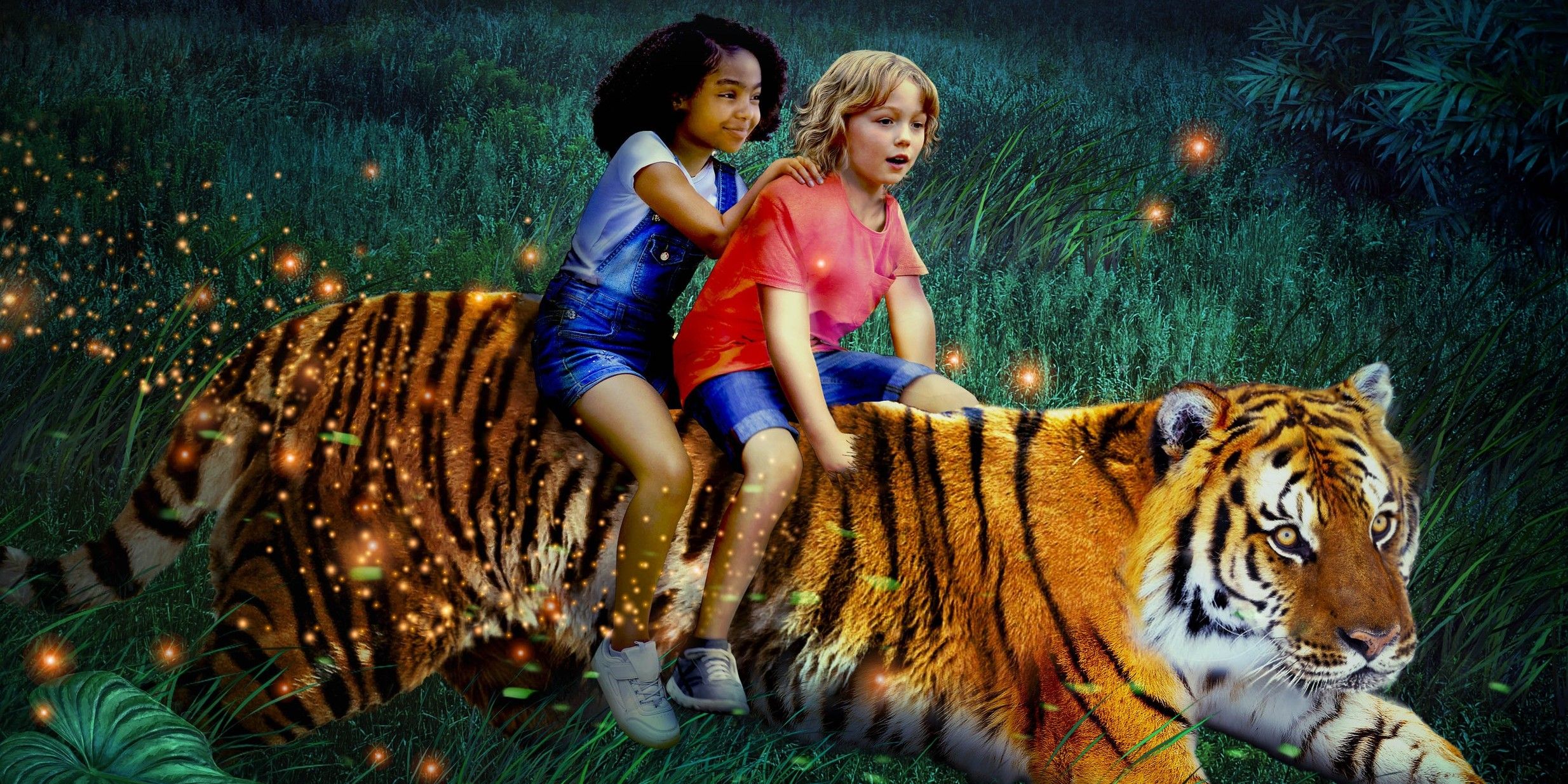 Two kids on the back of a tiger