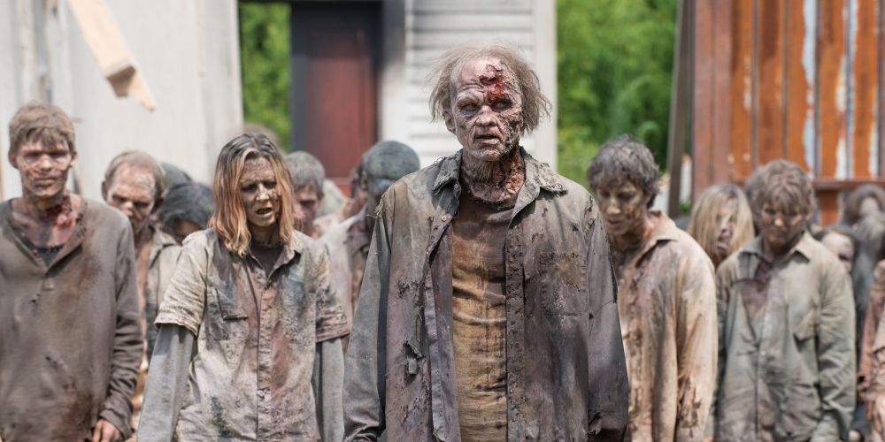 Walkers invading Alexandra in The Walking Dead.