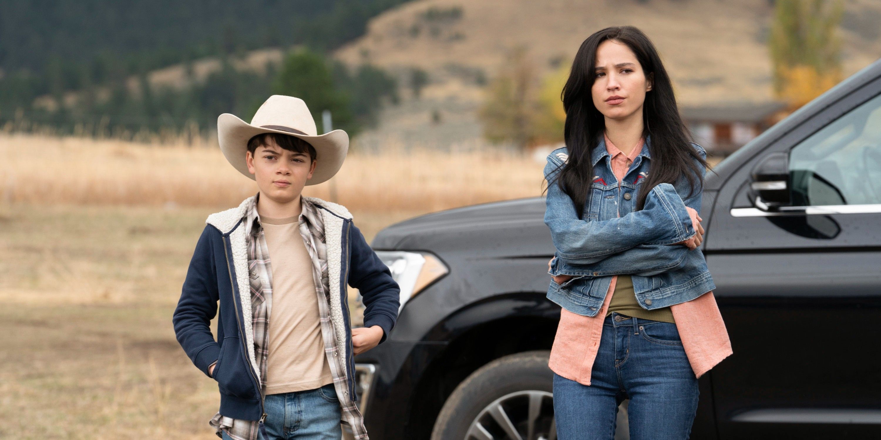 Monica and Tate stand outside of truck