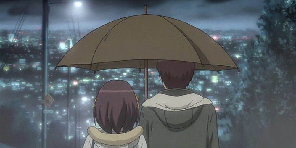 haruhi and kyon walk under an umbrella
