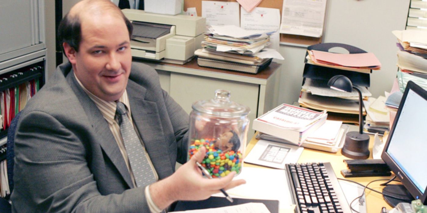 kevin malone the office holding jar of skittles