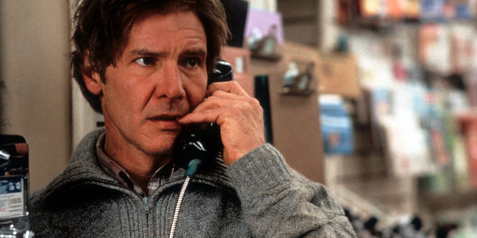 An image of Harrison Ford answering the phone as Dr. Richard Kimble in The Fugitive