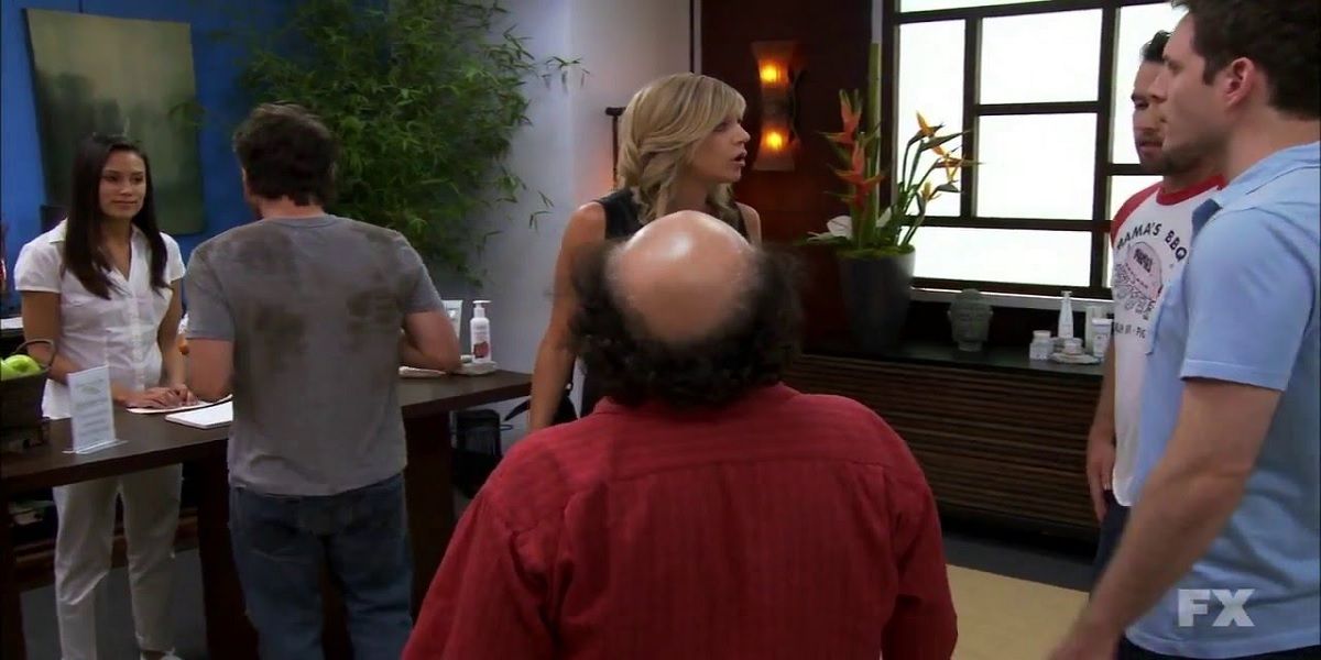 Charlie talks to a spa worker while the gang chats from It's Always Sunny in Philadelphia