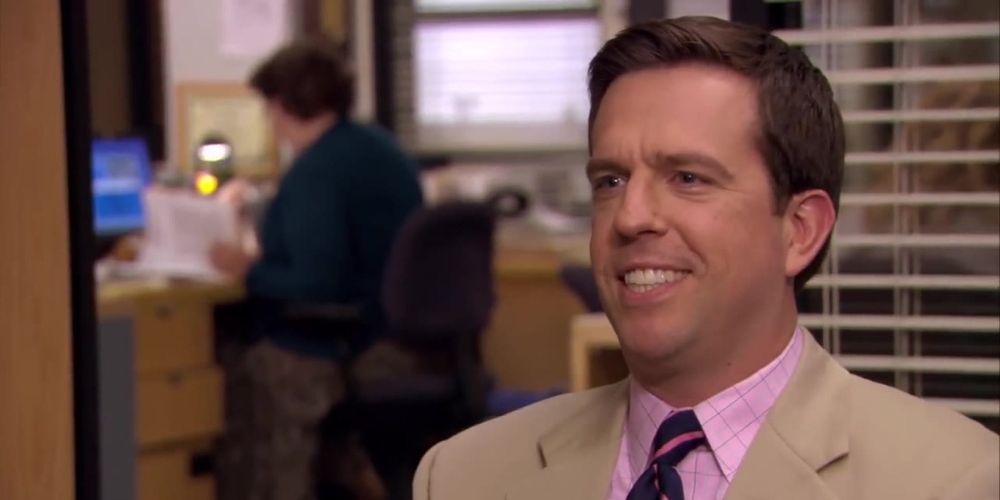 Ed Helms smiling as Andy Bernard in The Office.