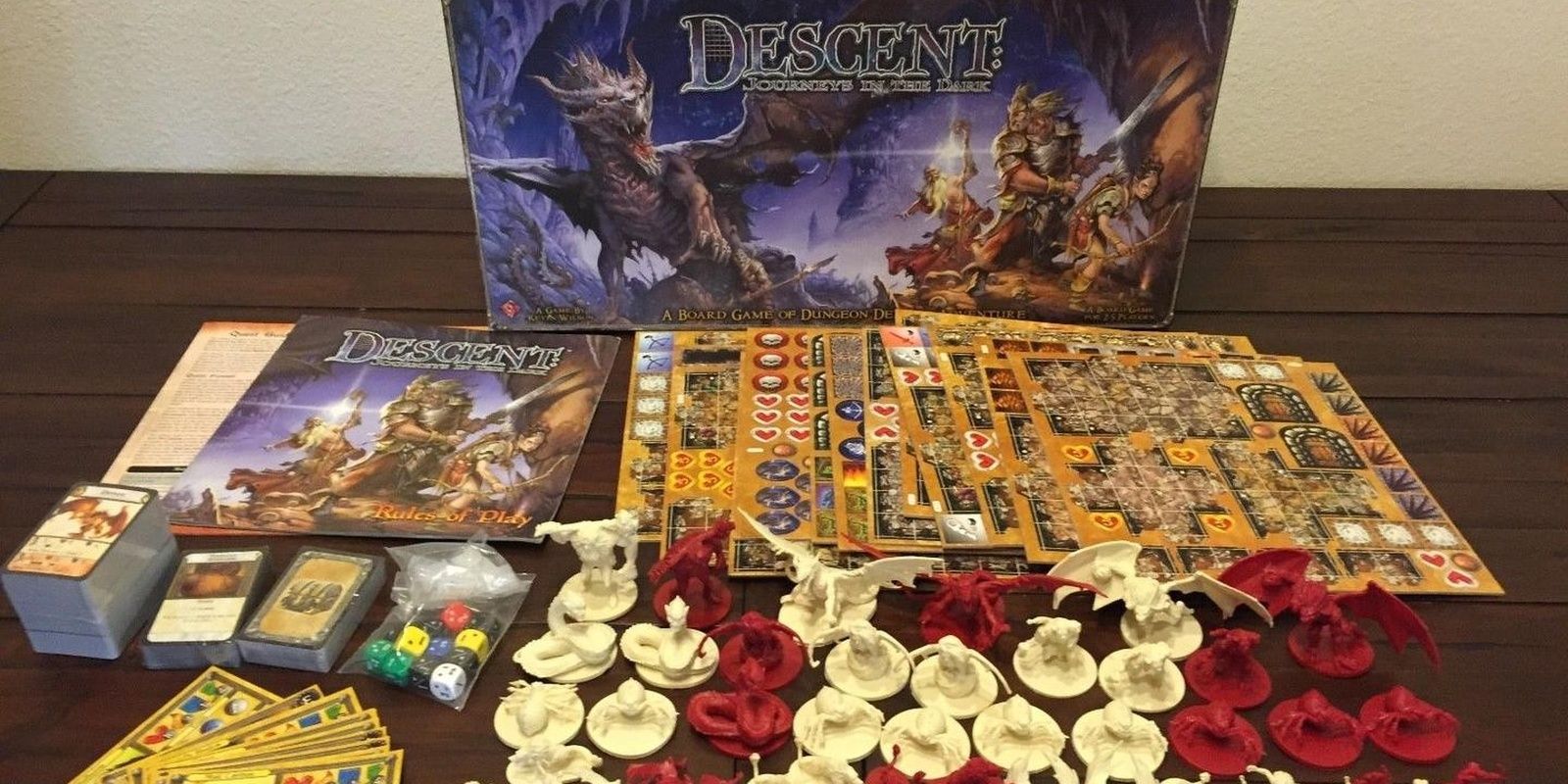 The components and box for Descent: Journeys in the Dark fantasy board game.