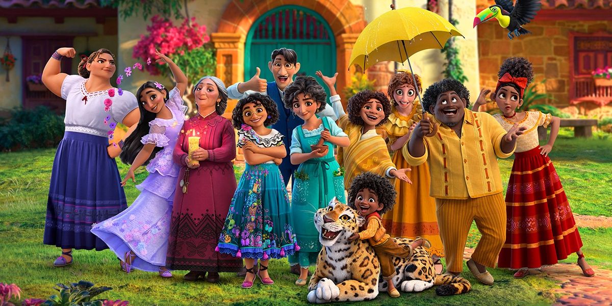 The Madrigal Family pose happily in front of their family home in Disney's Encanto.