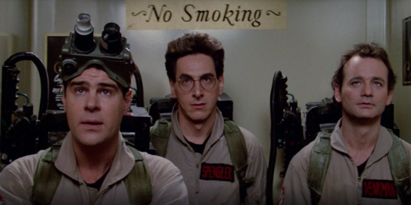 Ghostbusters Ray Stantz, Peter Venkman and Egon Spengler ride an elevator.