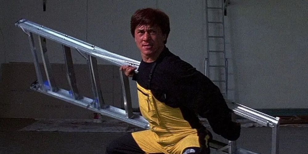 Jackie Chan fights off opponents with a ladder in Police Story 4: First Strike movie