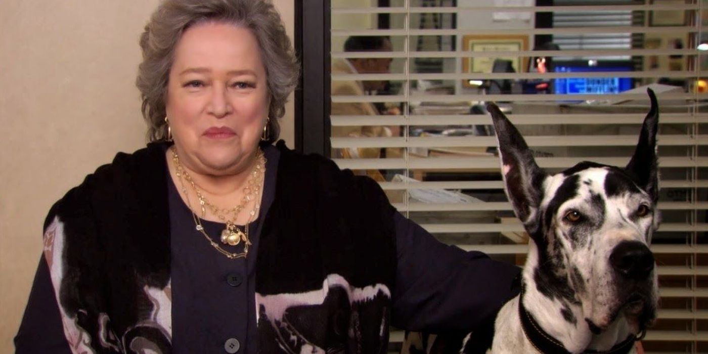 Jo Bennett sat smiling at the camera with her dog from The Office