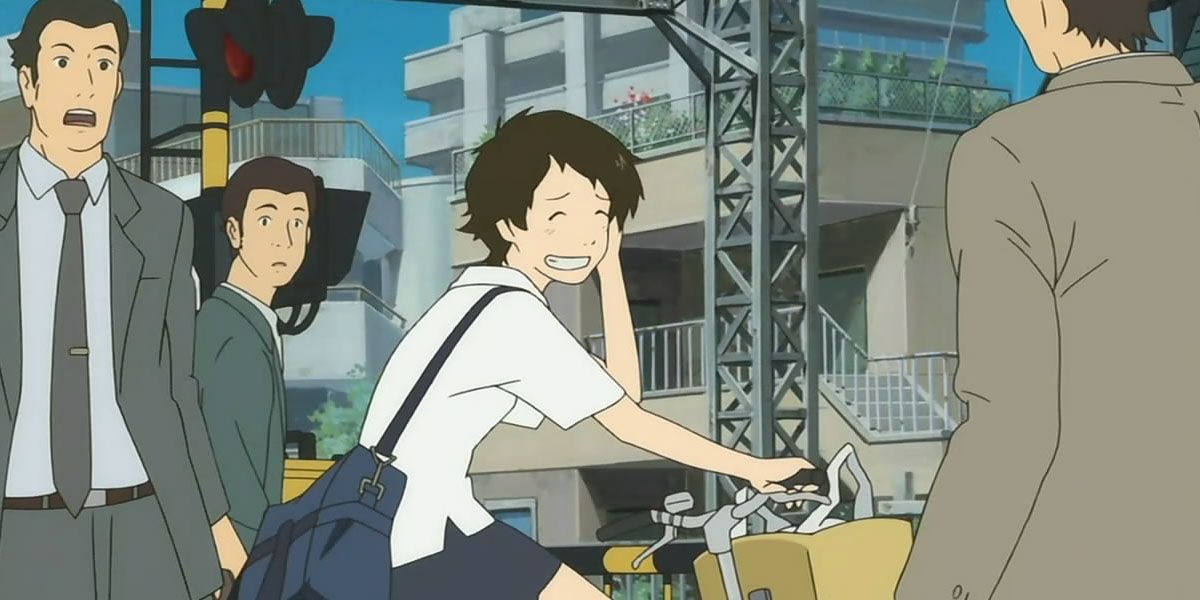 Makoto smiles sheepishly while riding her bike