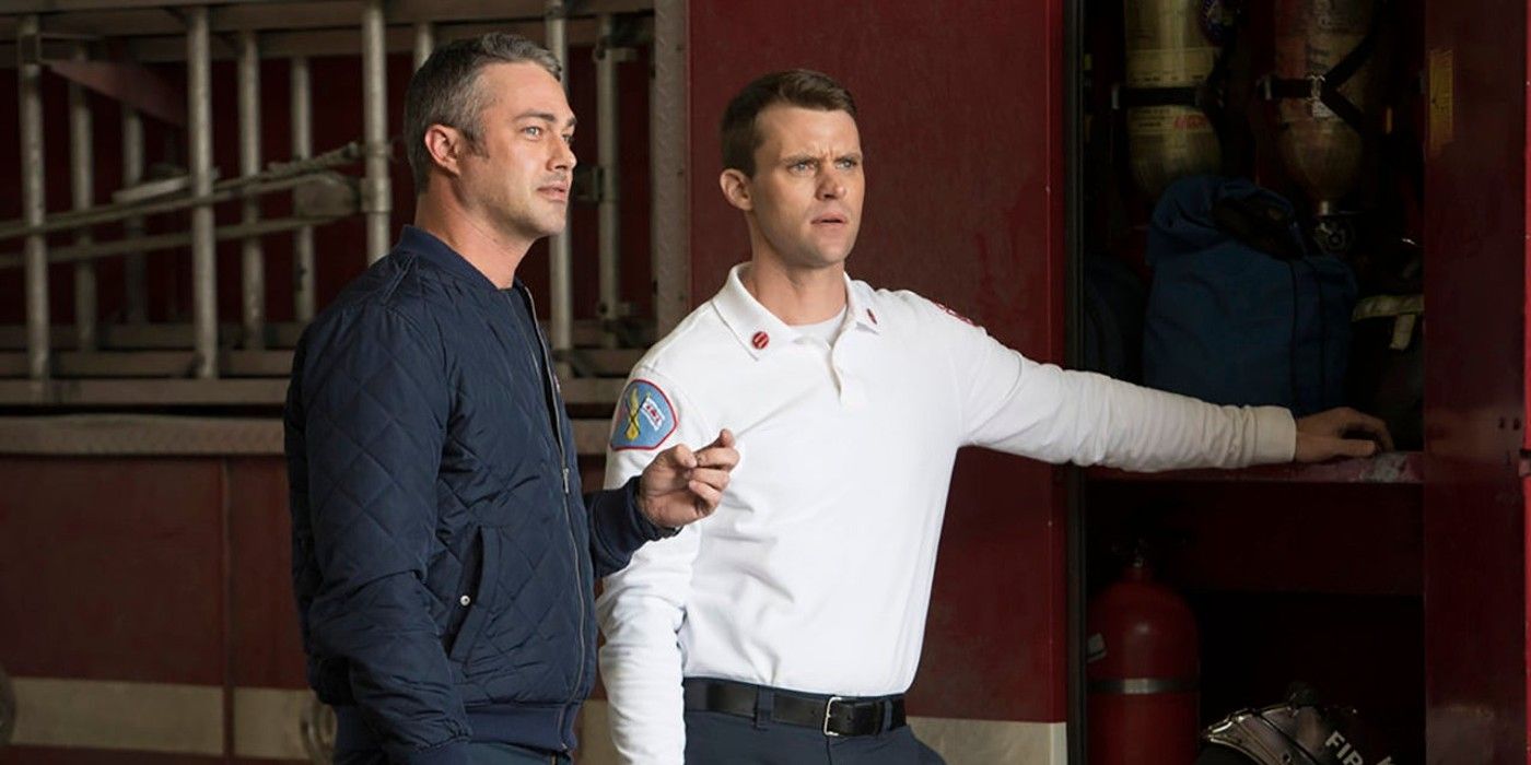 Matt Casey and Kelly Severide stand next to a fire engine on Chicago Fire