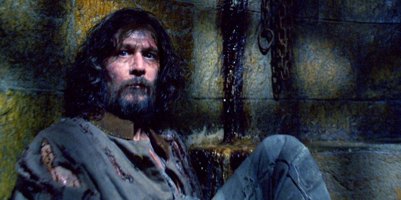 Sirius Black sitting down inside his Azkaban cell