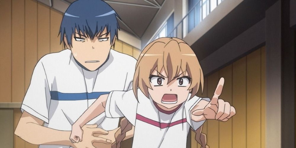 Ryuuji standing behind Taiga while she points at someone