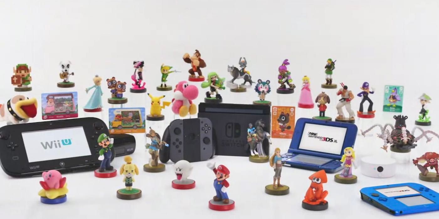 Out-of-box amiibo displayed around various Nintendo systems.