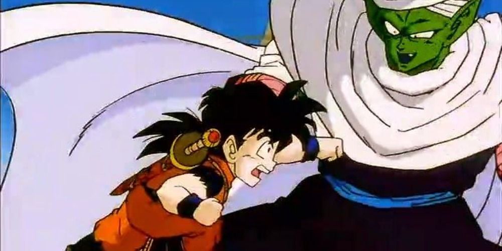 Gohan with sword on his back attacking Piccolo
