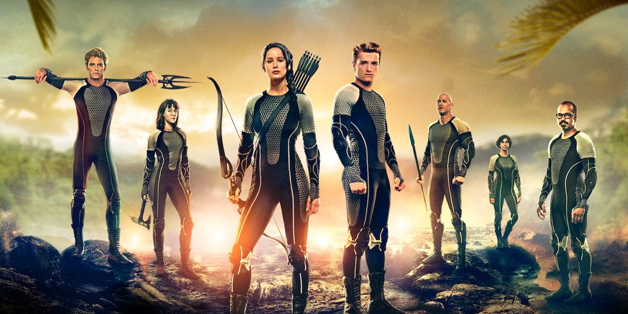 Various Hunger Games Victors, including Katniss and Peeta, posing in their Quarter Quell attire in Catching Fire promotional materials.