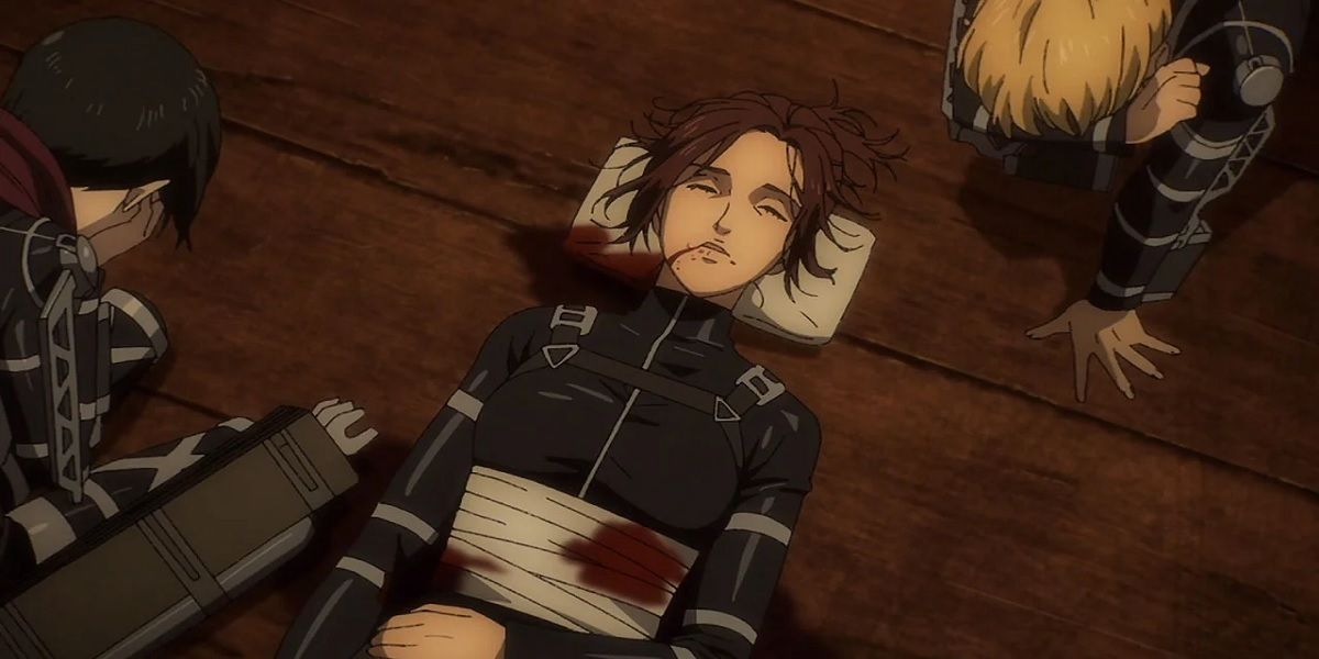Mikasa Ackerman and Armin Arlert cry as Sasha Braus dies in Season 4, Episode 8 — "Assassin's Bullet" — of Attack on Titan
