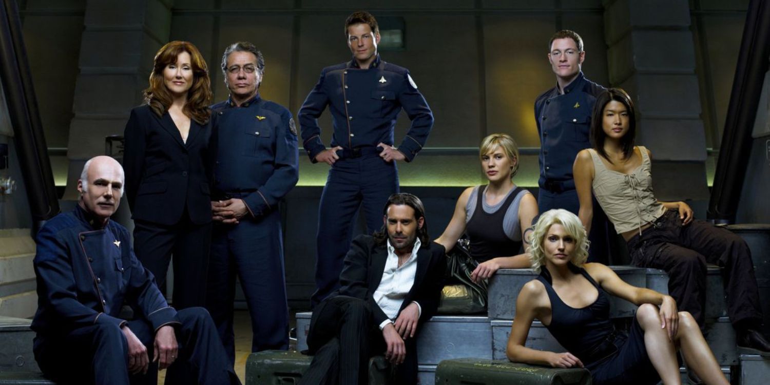 The cast of Battlestar Galactica sitting together aboard their ship