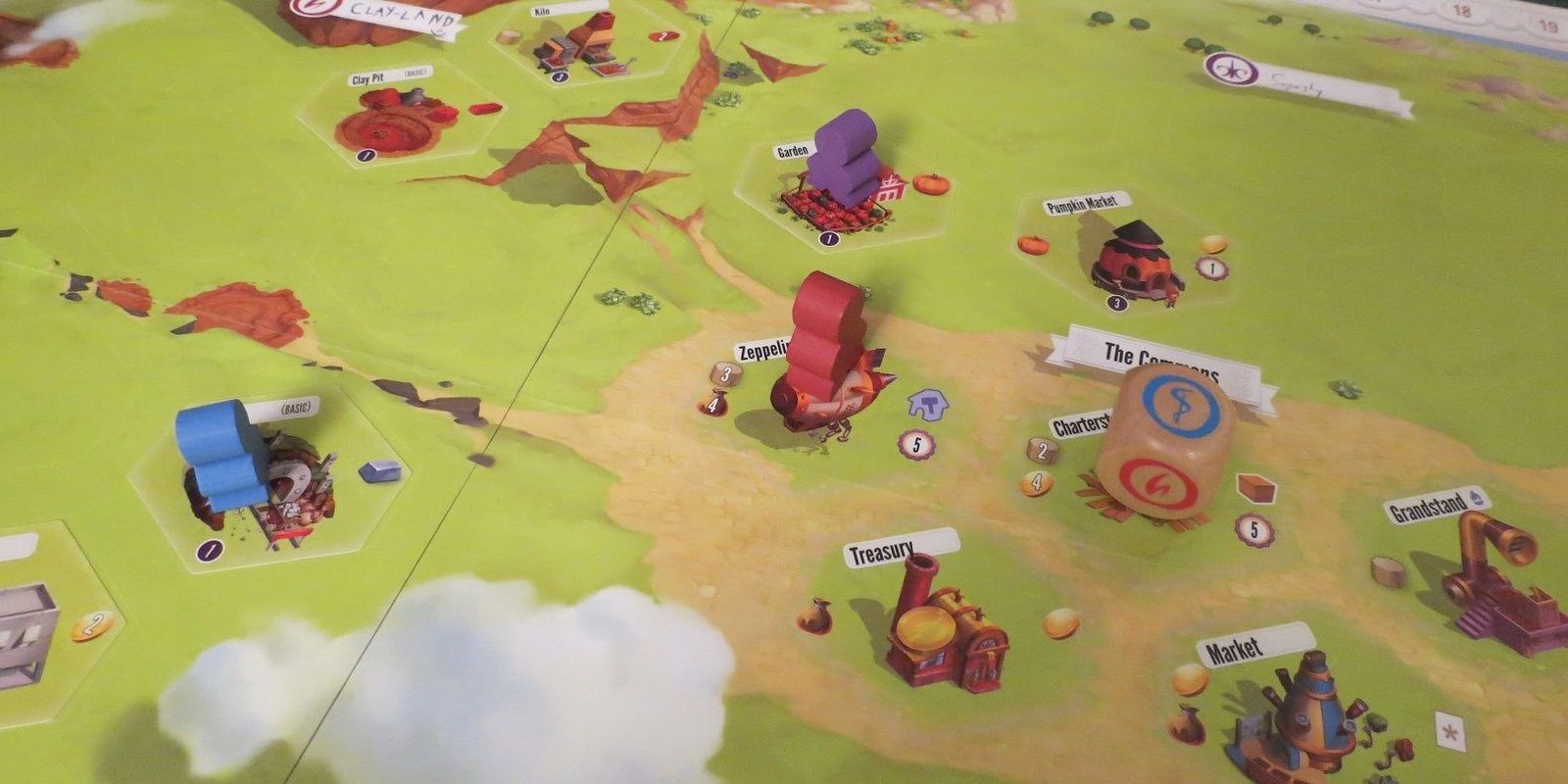Charterstone Board Game Being Played On The Table