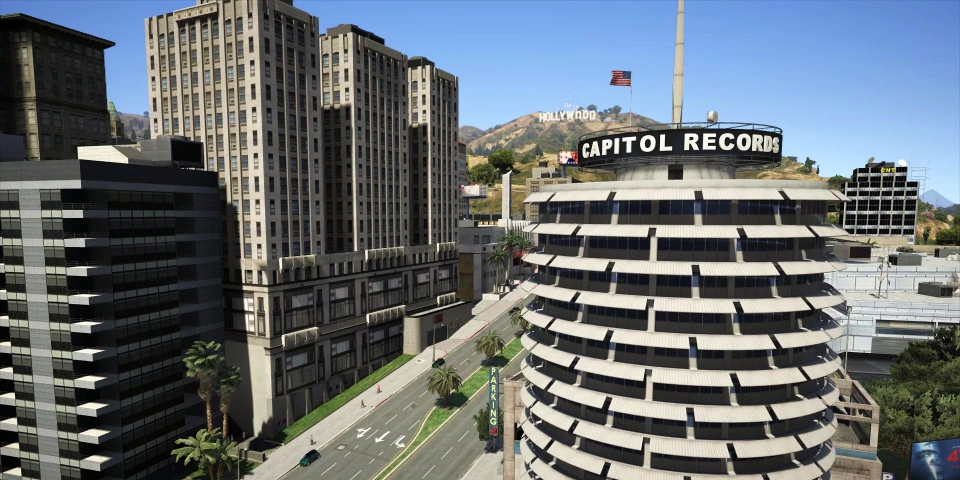 Screenshot of the Real California Architecture mod depicting Capitol Records and the Hollywood sign in GTA V.
