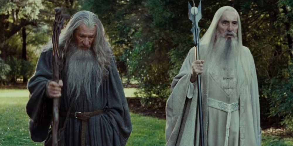 Gandalf the Grey and Saruman the White walk together in Lord of the Rings.