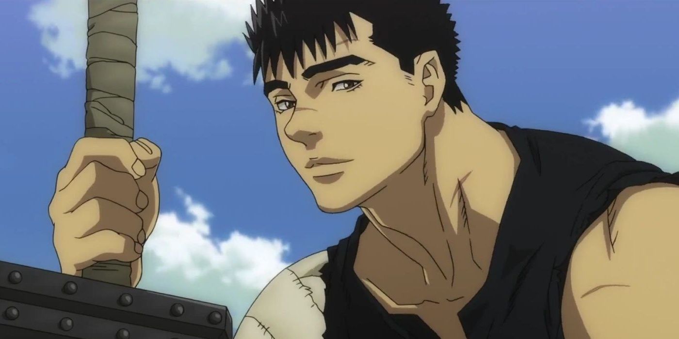Guts smiling against a blue sky