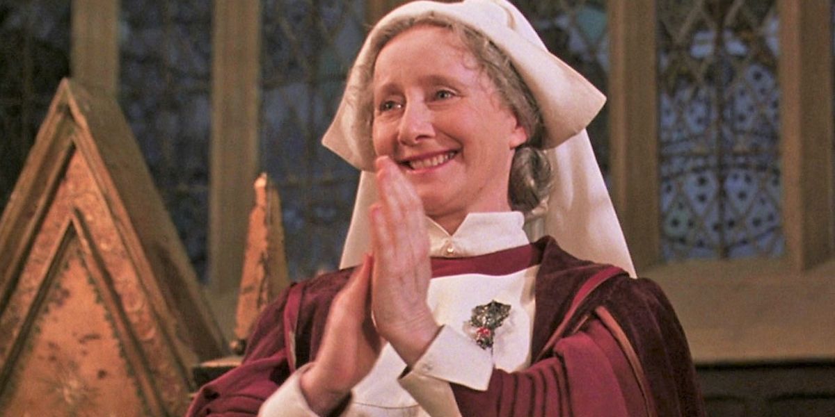 madam pomfrey smiling and clapping in harry potter